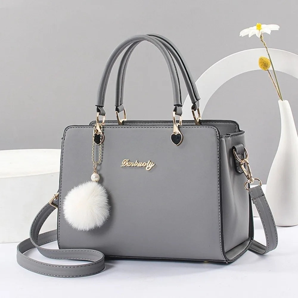 Size chart for the black handbag showing dimensions of 24cm length and 18cm height