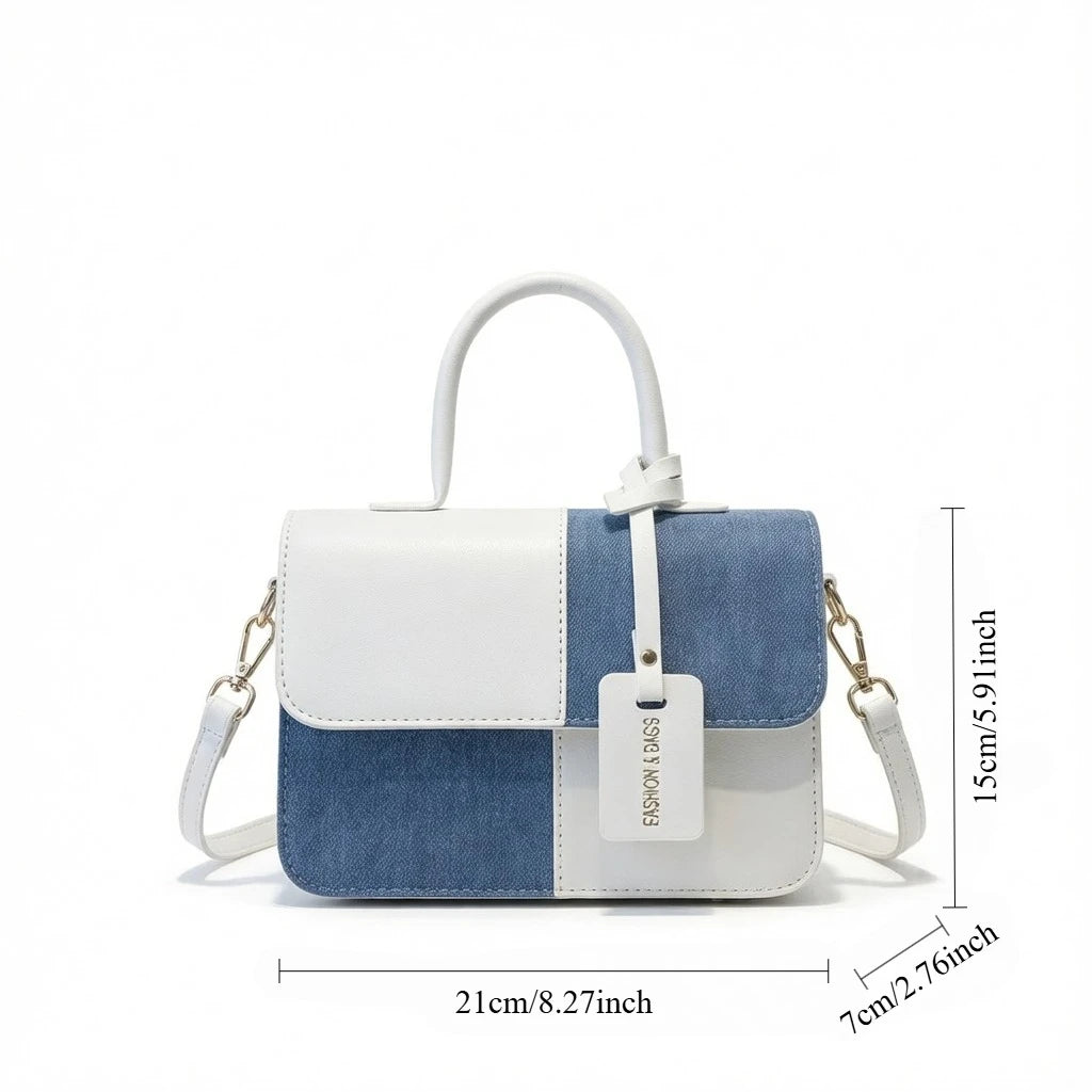 Modern blue and white patchwork leather handbag with top handle and adjustable shoulder strap