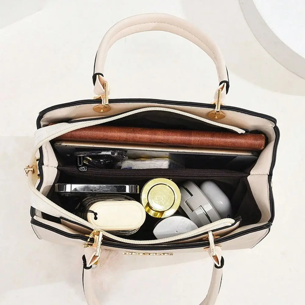 Elegant cream white handbag showing a spacious interior organized with personal accessories