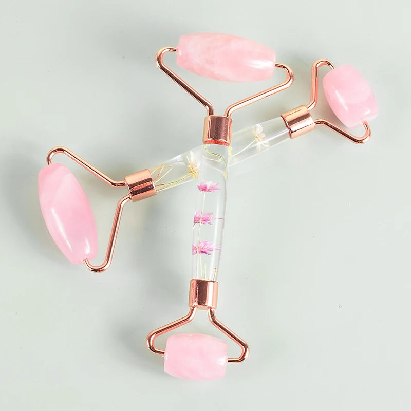 Two pink rose quartz facial rollers with transparent handles for professional skincare - Aurora Nova 4