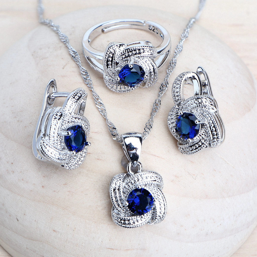925 sterling silver necklace and earrings set featuring faceted royal blue crystals, highlighting the brilliance and elegance of the Real Blue design.