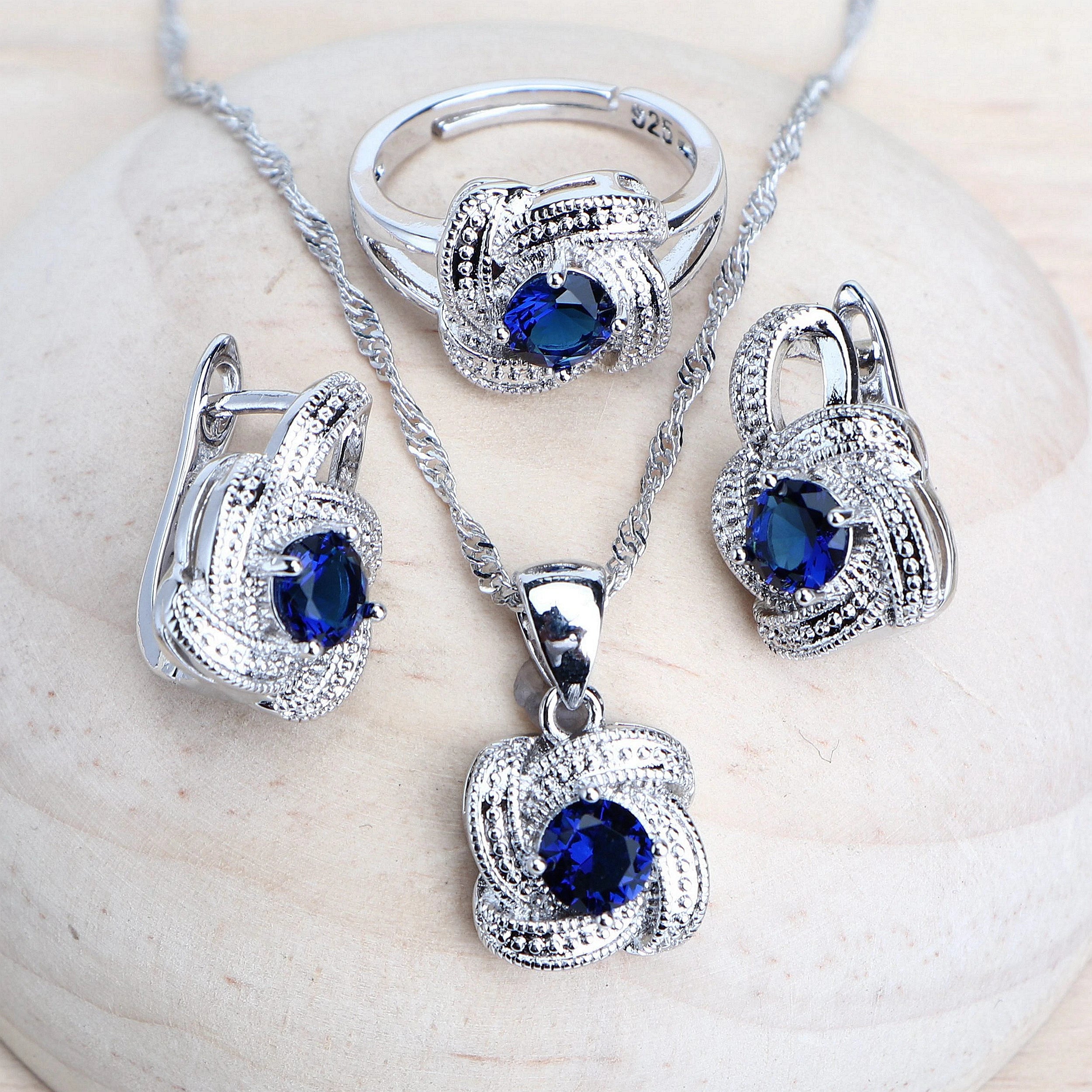 925 sterling silver necklace and earrings set featuring faceted royal blue crystals, highlighting the brilliance and elegance of the Real Blue design.