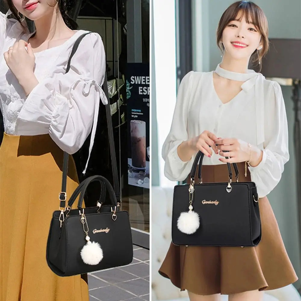 isplay of elegant top handle handbags in navy, sky blue, pink, red, and beige