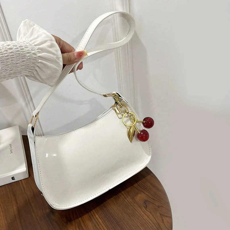 Stylish designer shoulder bag for women, perfect for professional or evening wear.