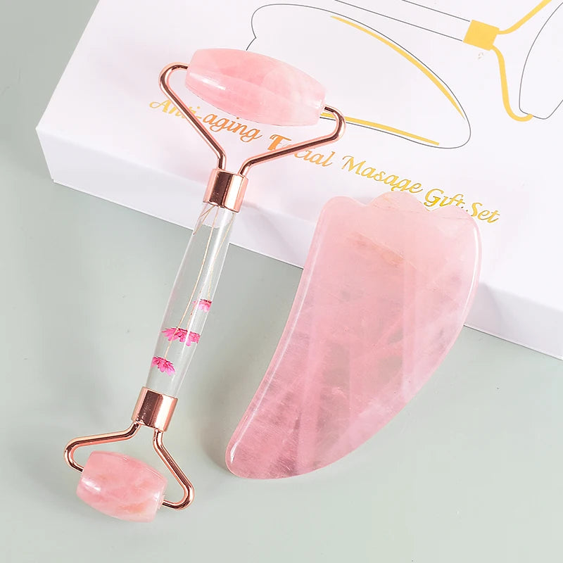 Several heart-shaped pink rose quartz gua sha stones held in a hand - Aurora Nova 4