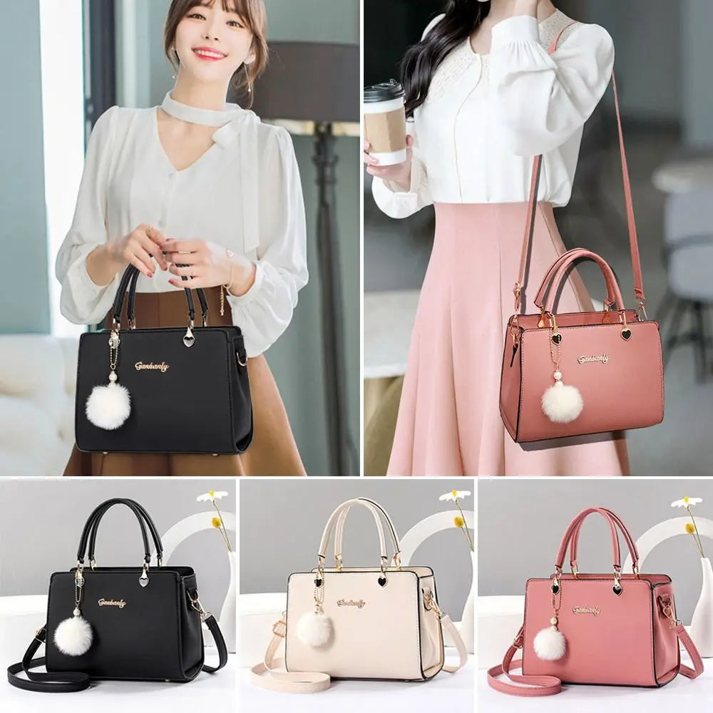 Collection of top handle handbags in blue, pink, and white with pompom charms