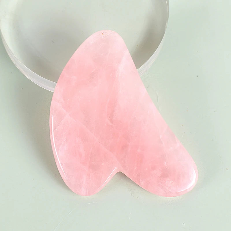 Detailed view of a smooth pink rose quartz stone on a facial roller - Aurora Nova 4