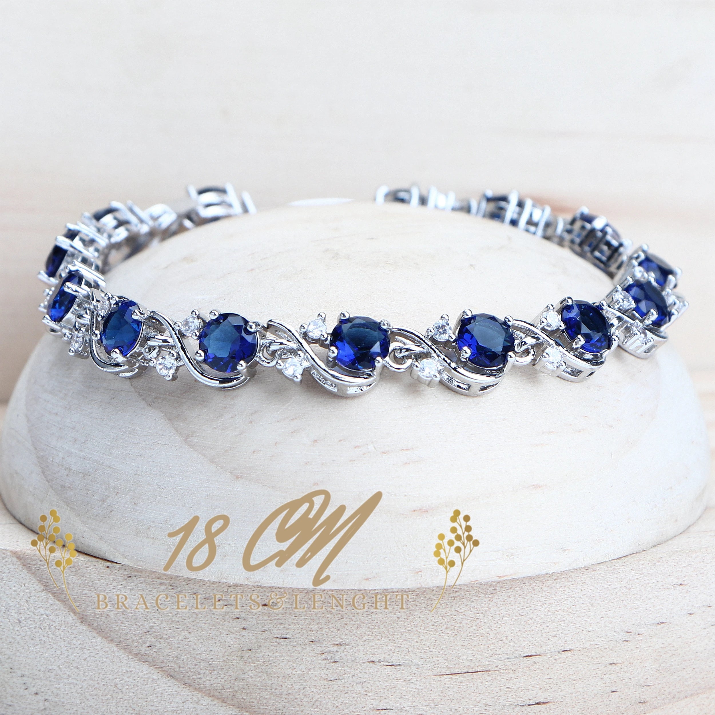  Elegant silver bracelet with sapphire blue gemstones and a length of 18cm
