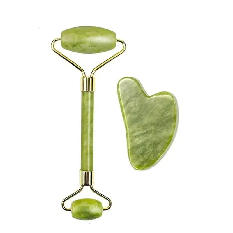 Classic green jade face roller and smooth heart gua sha scraping tool.
​