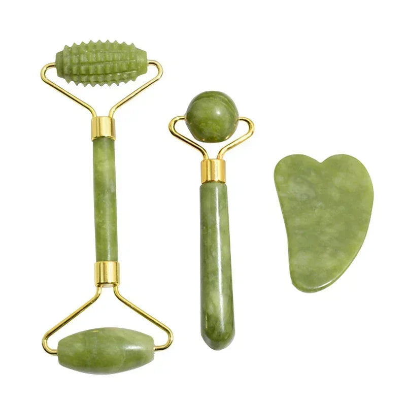 Gift box containing two different jade face rollers and a gua sha scraper